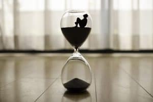 man stuck in an hourglass