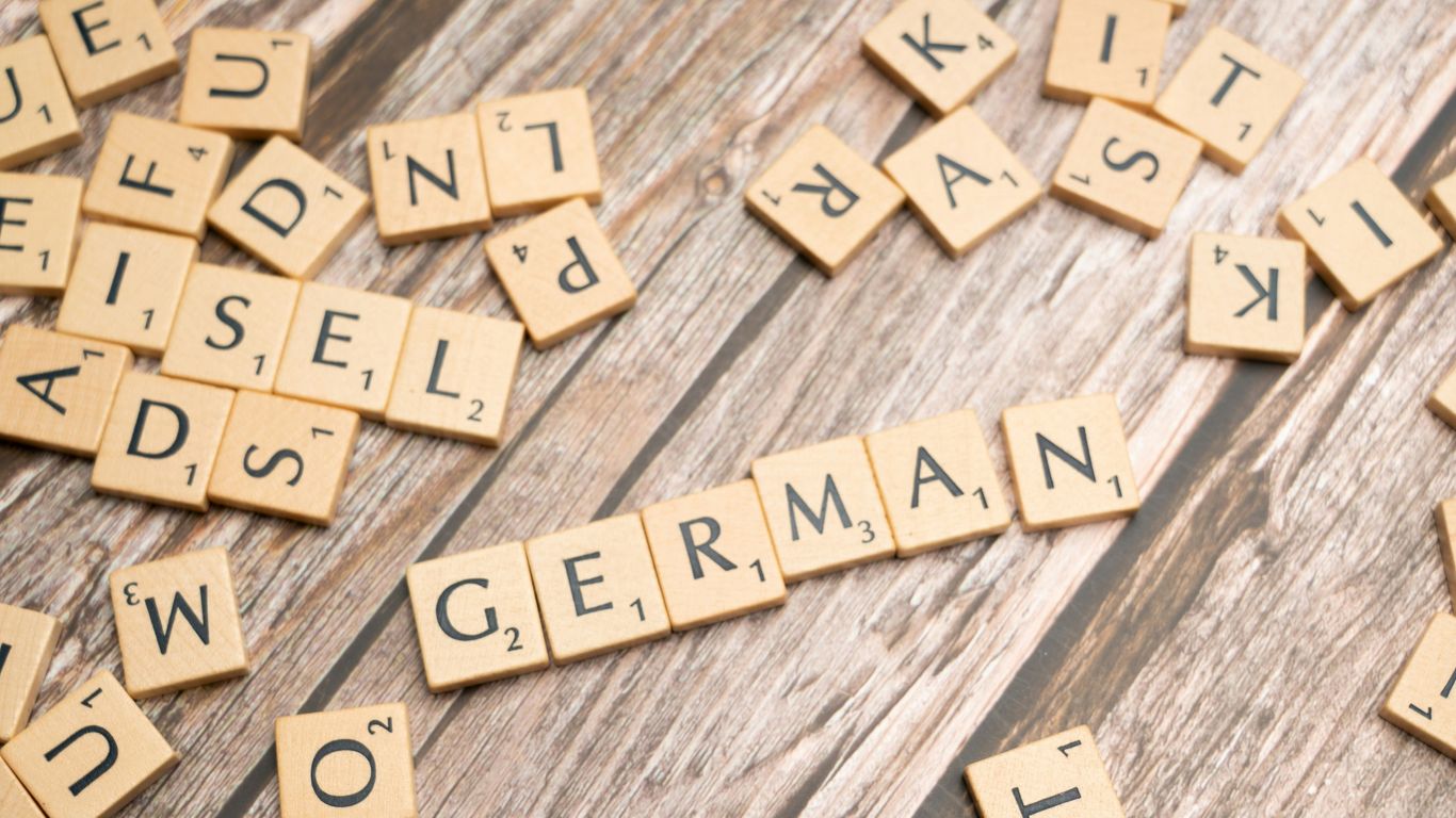 scrabble tiles spelling out words on a wooden surface