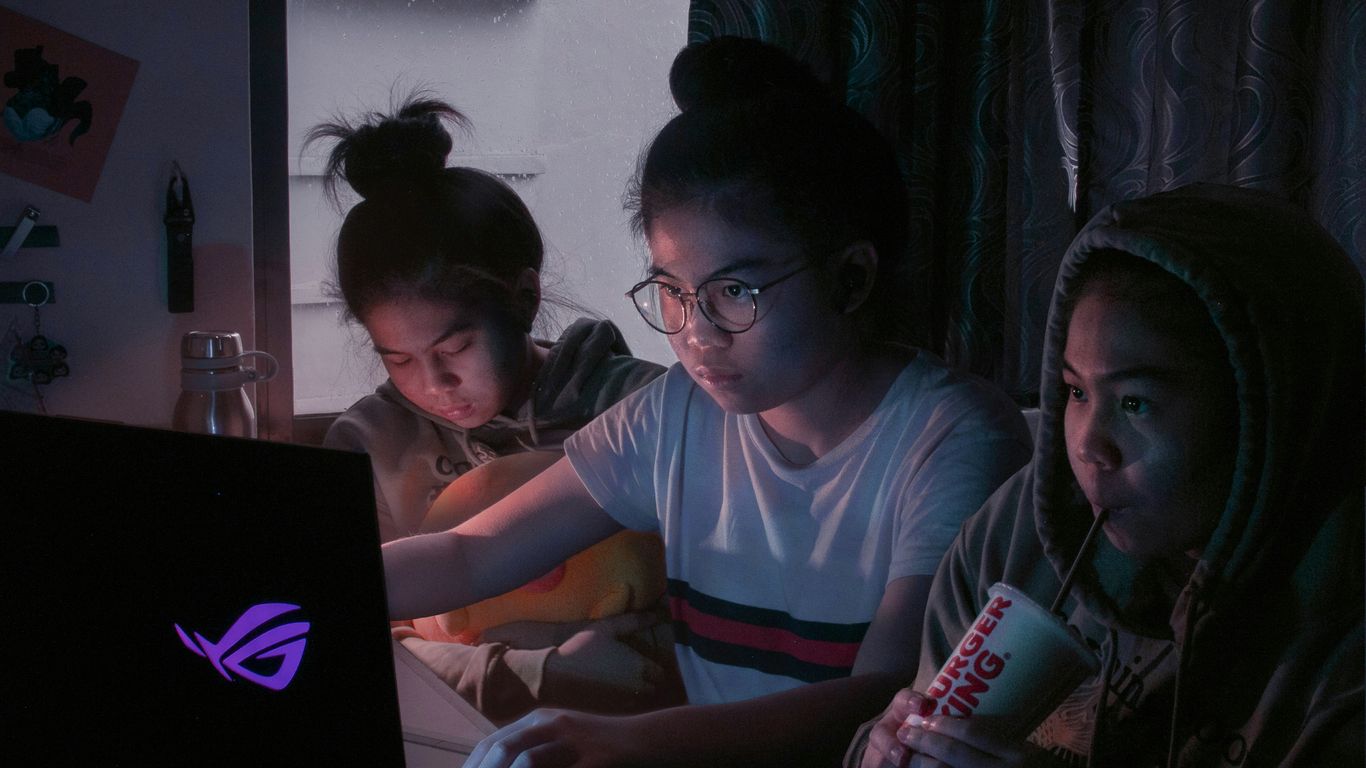 man in blue crew neck t-shirt holding coca cola can