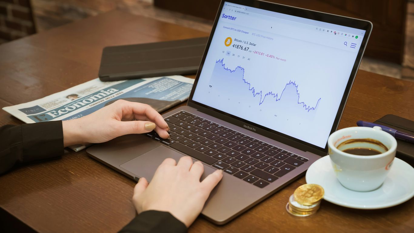a person using a laptop computer on a table
