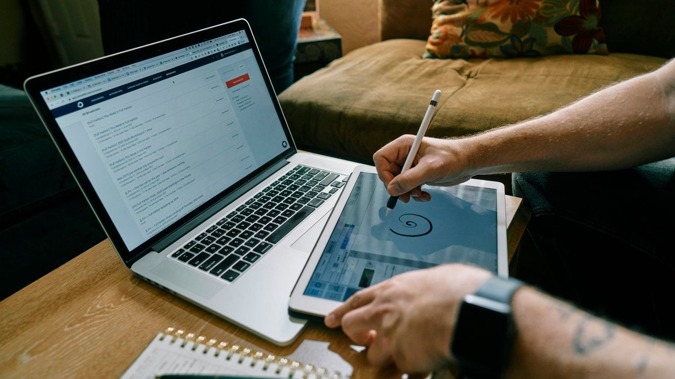 person writing on white paper