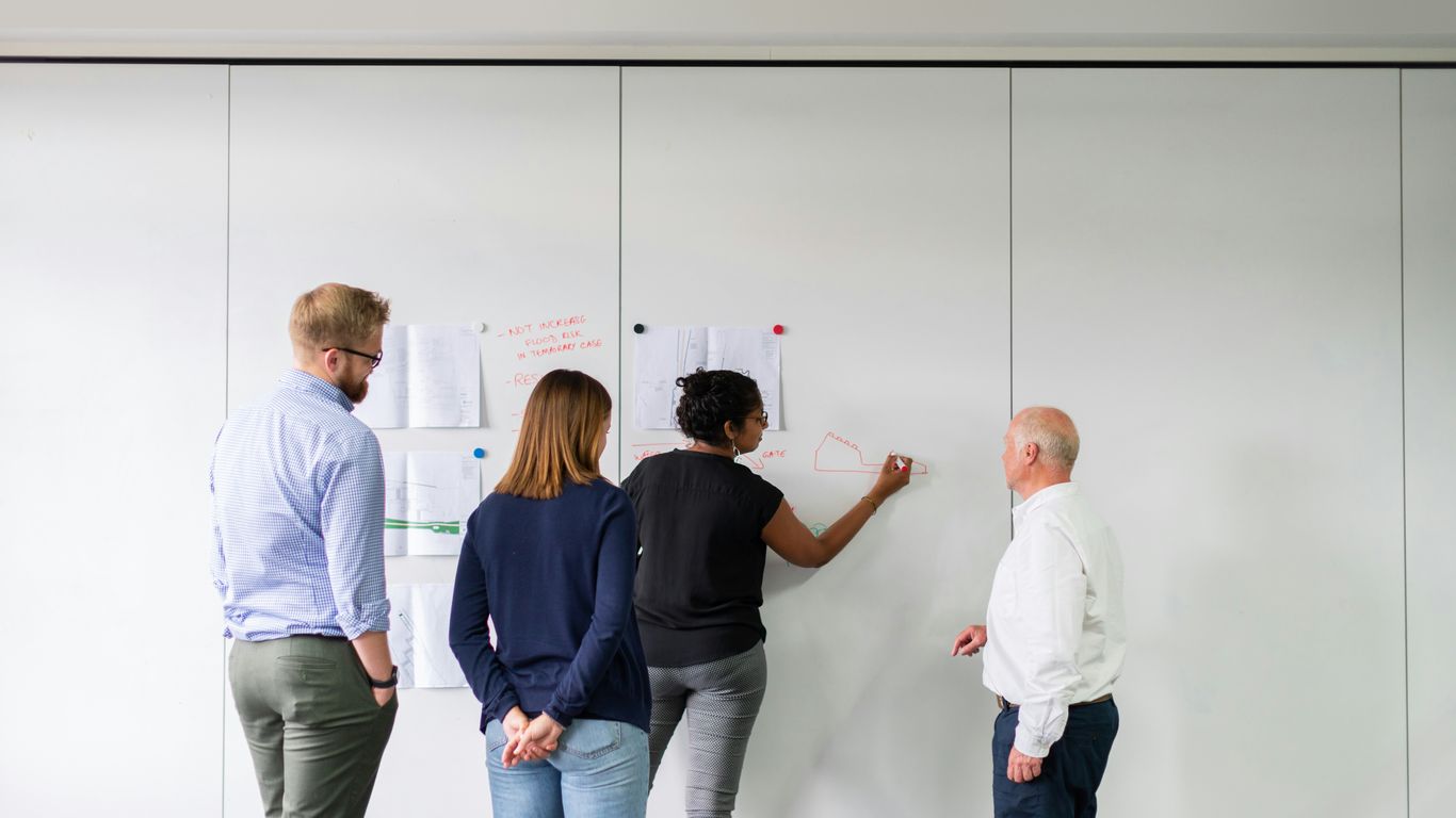 man in blue dress shirt and woman in black long sleeve shirt