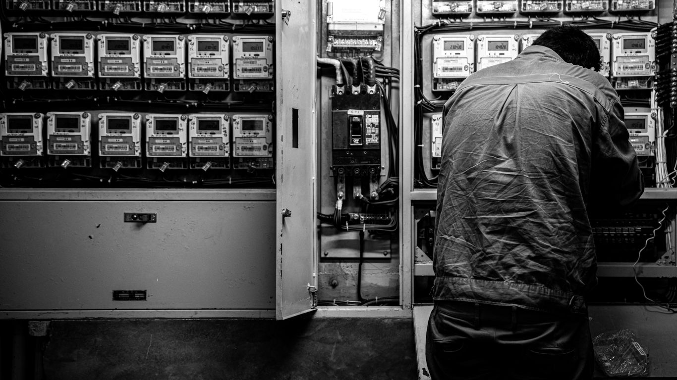 a man standing in front of a machine