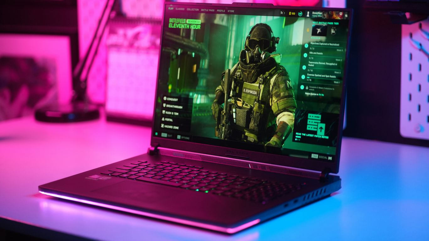 Gaming laptop displaying a first-person shooter game.