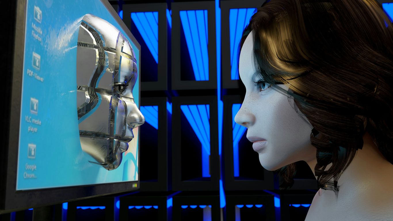 a female mannequin is looking at a computer screen